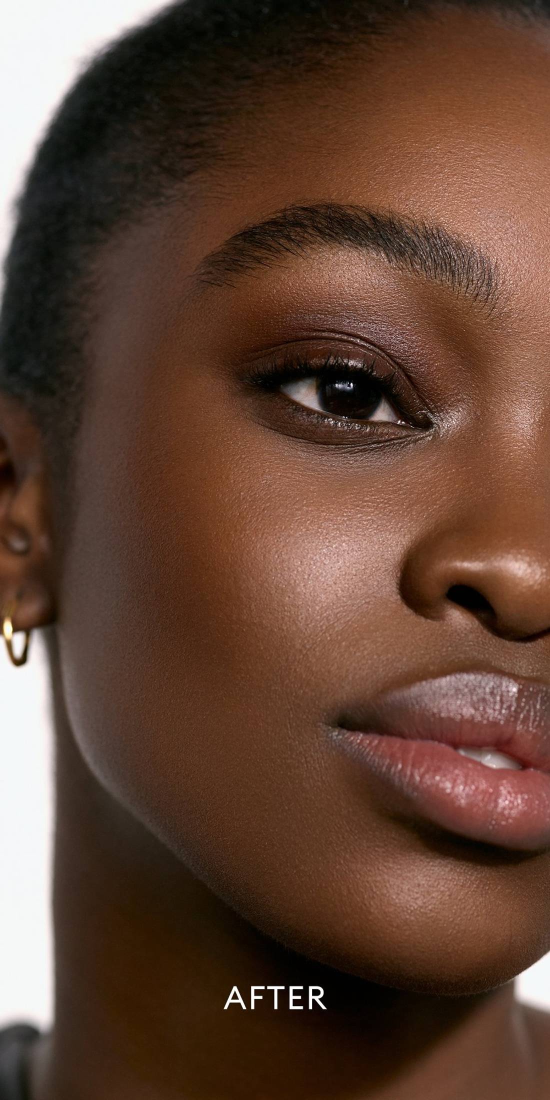 After image of a deep skin tone model wearing a deep shade of the Solar Infusion Soft-Focus Cream in Capri 1