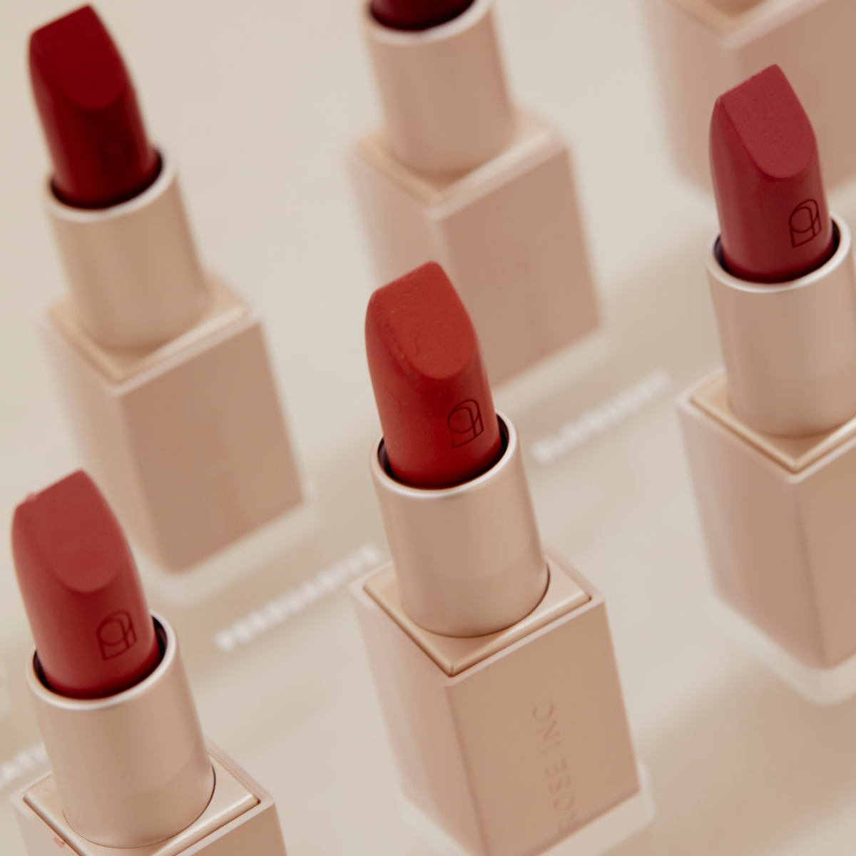 Lips applying Lip Cream Weightless Matte Color in shade Love Beckons.